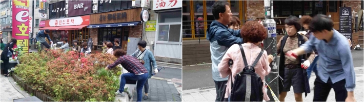 영통3동 중심상가 일대를 주민들이 청소하고 있는 모습