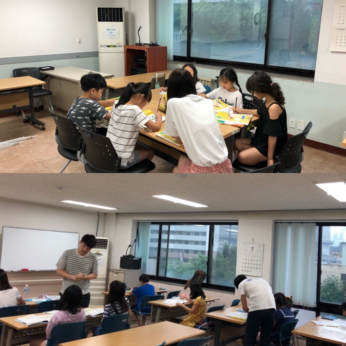 우만2동 햇살공부방에서 초등학생들의 학습지도를 아주대학교 학생들이 돕고 있다.