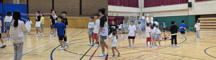 체육관에서 2학년과 5학년 학생들이 긴줄넘기를 같이 즐겁게 하고 있다.